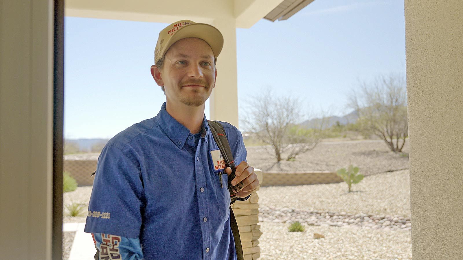 Nichols technician arriving at a customer's front door