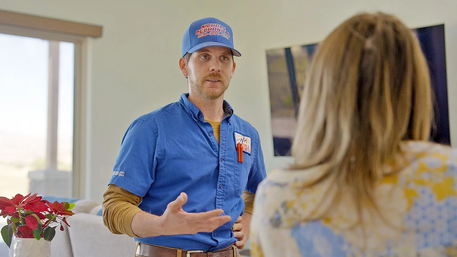 Nichols technician talking with a homeowner