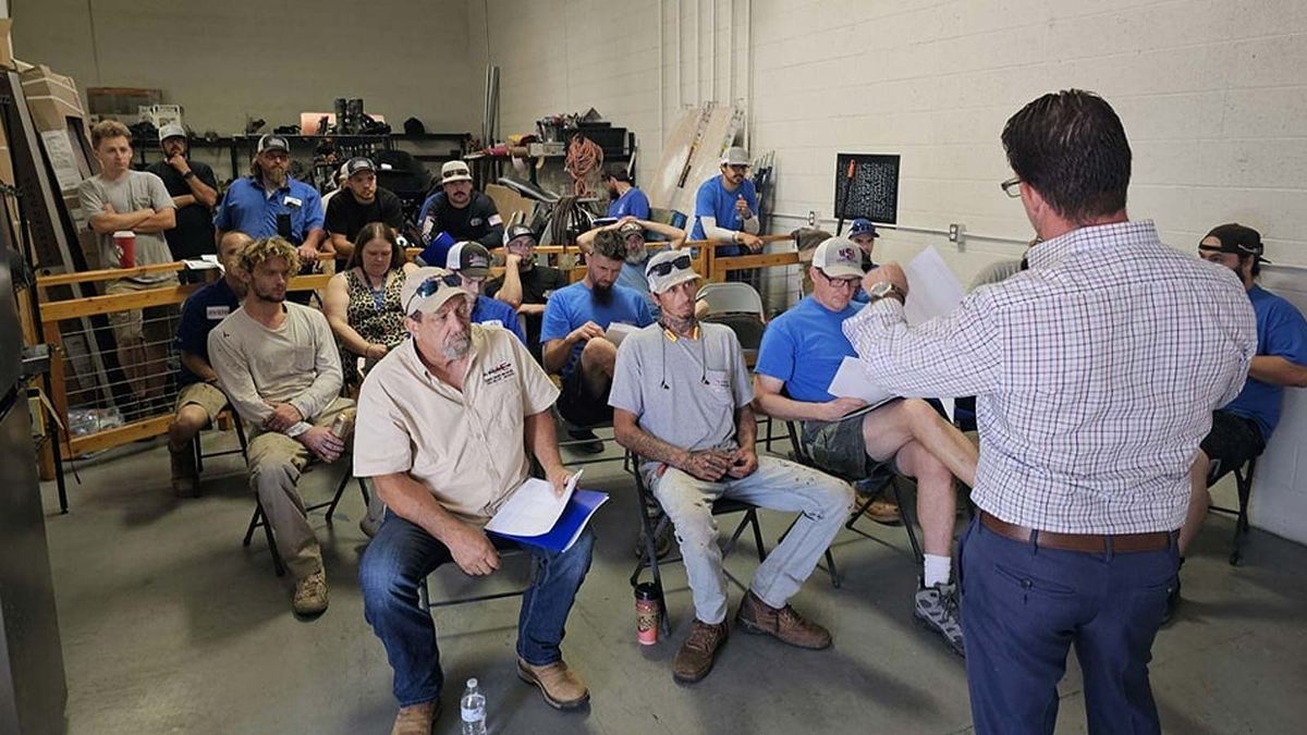 Nichols employees in a training session at the shop