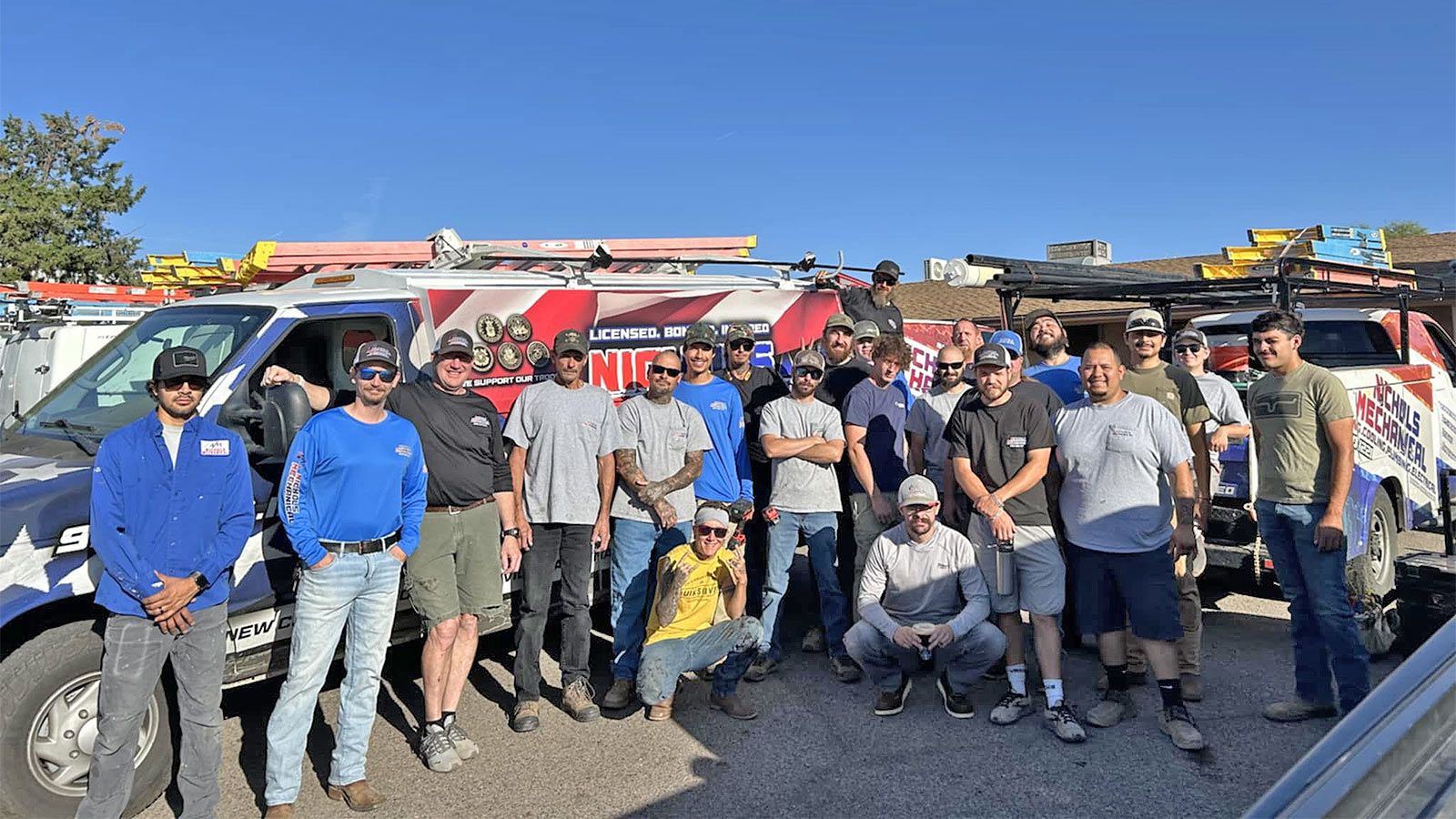 The Nichols Plumbing, Electrical & HVAC team in front of their fleet in Cottonwood
